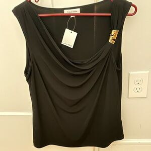 Moving, everything must go. Calvin Klein dress top with a gold accent